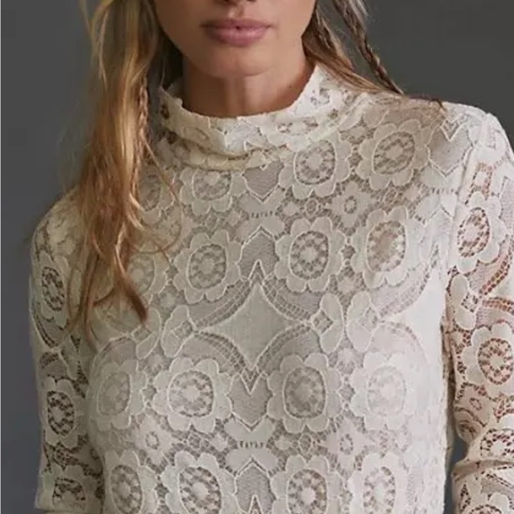 Beautiful lace Anthro top can be worn both in a casual or fancier setting